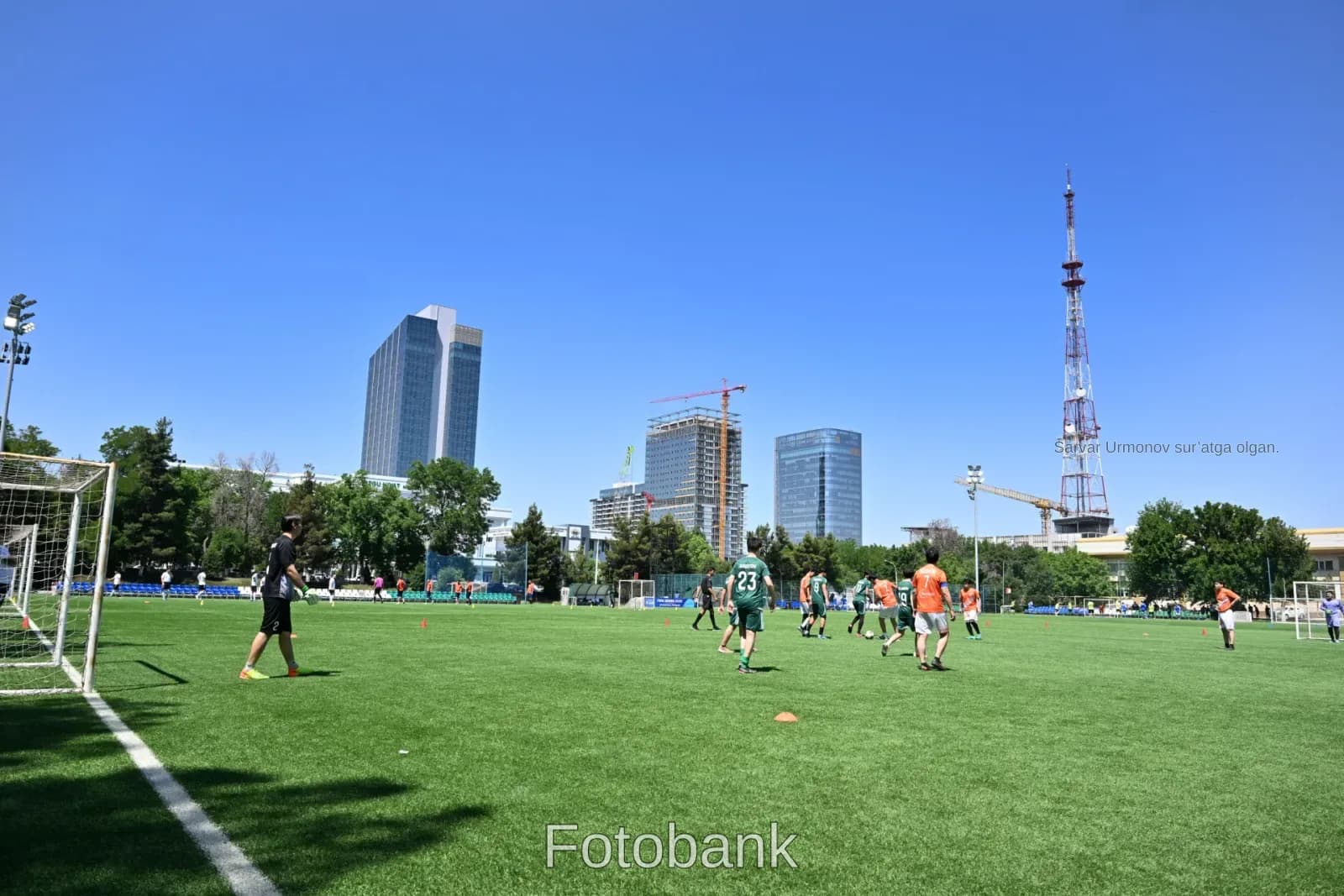 Men playing football on field