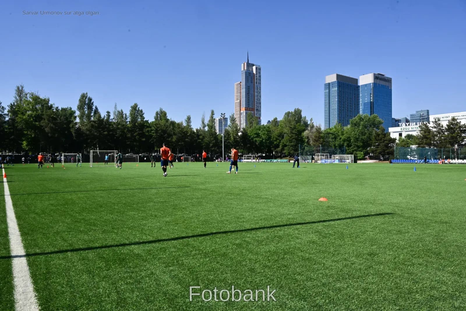 Players training on outdoor soccer pitch