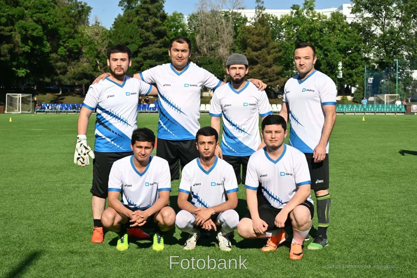 Amateur soccer team posing outdoors