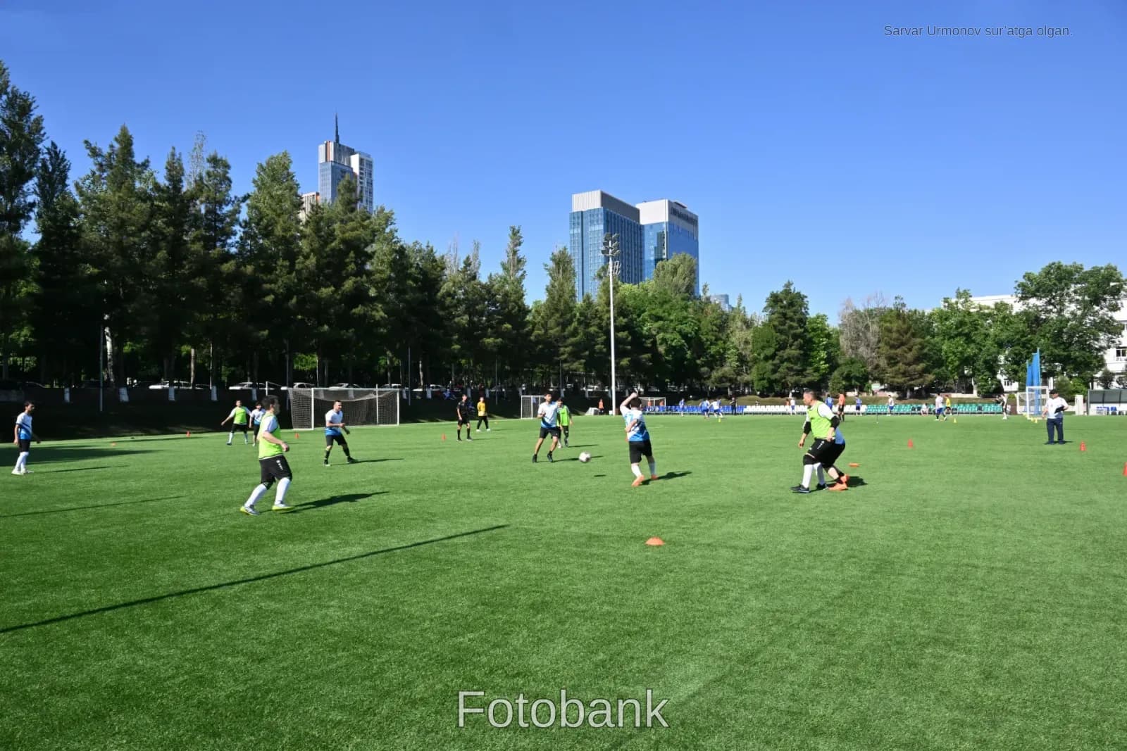 Men playing football on field
