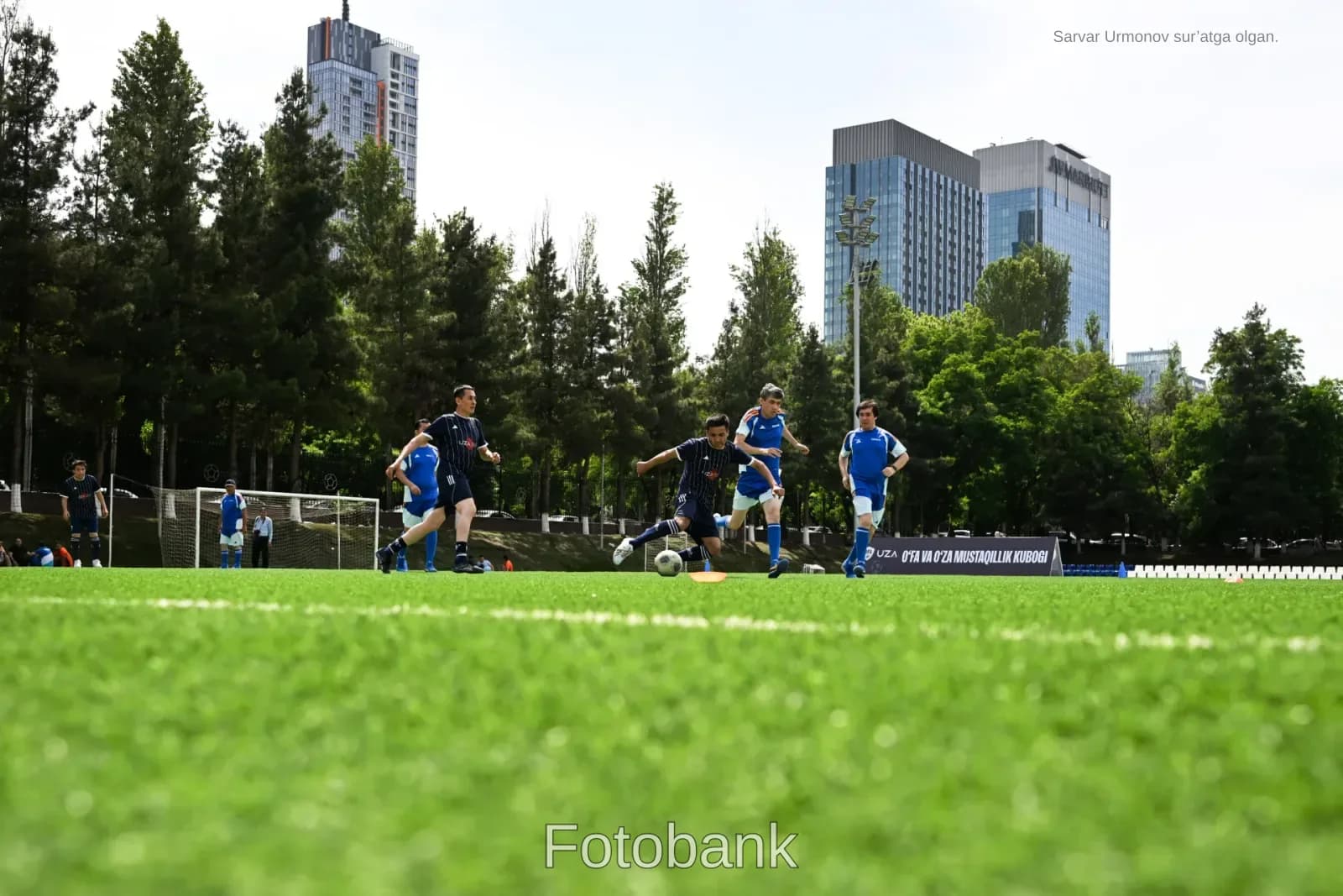 Men playing football on field
