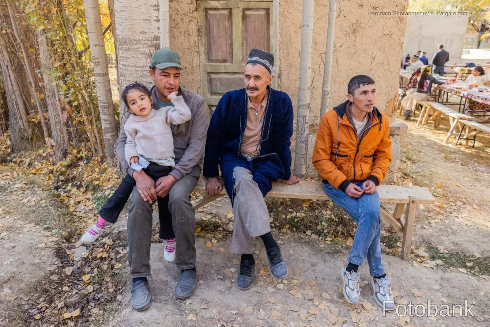 People sitting on a bench outdoors