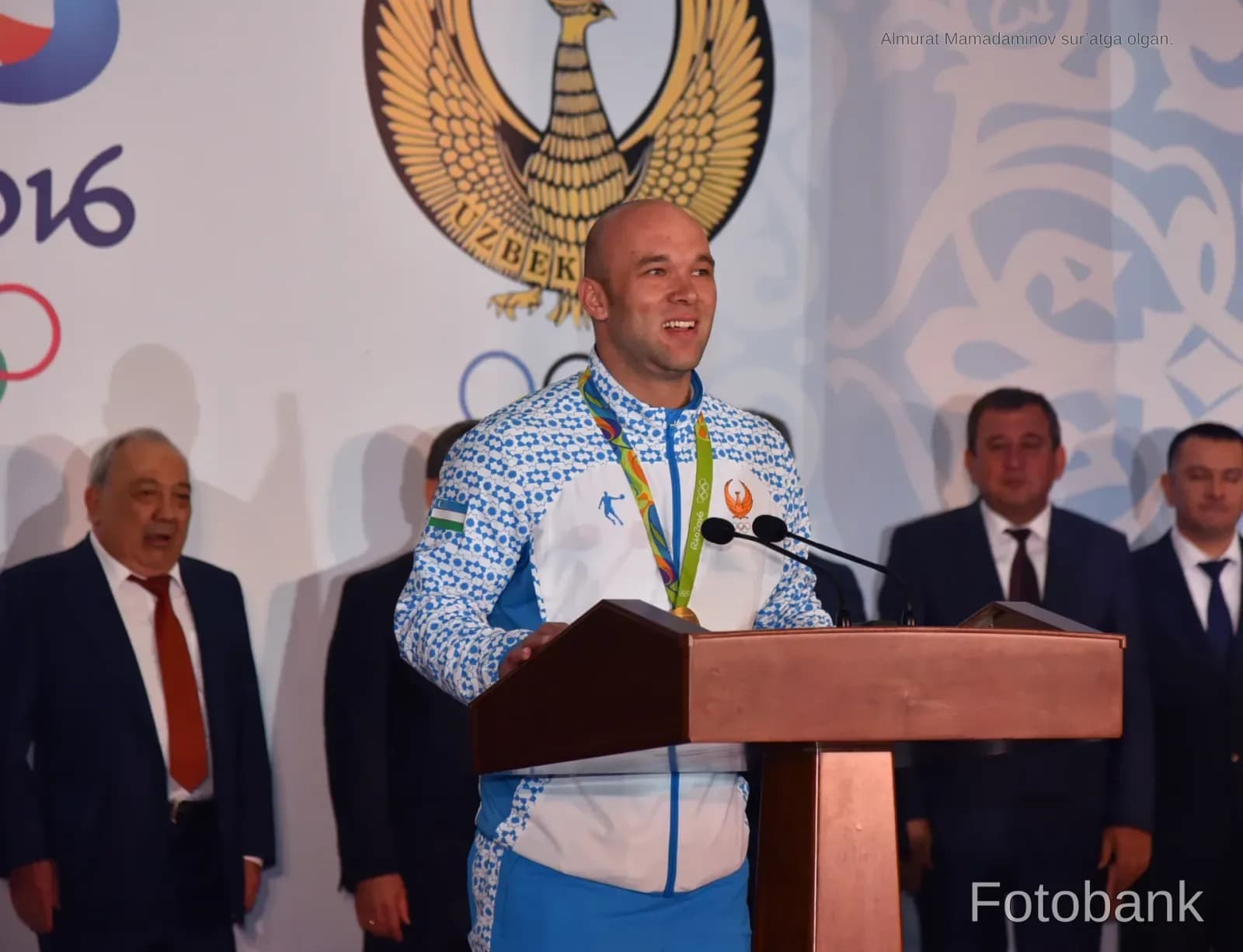Athlete speaking at a podium
