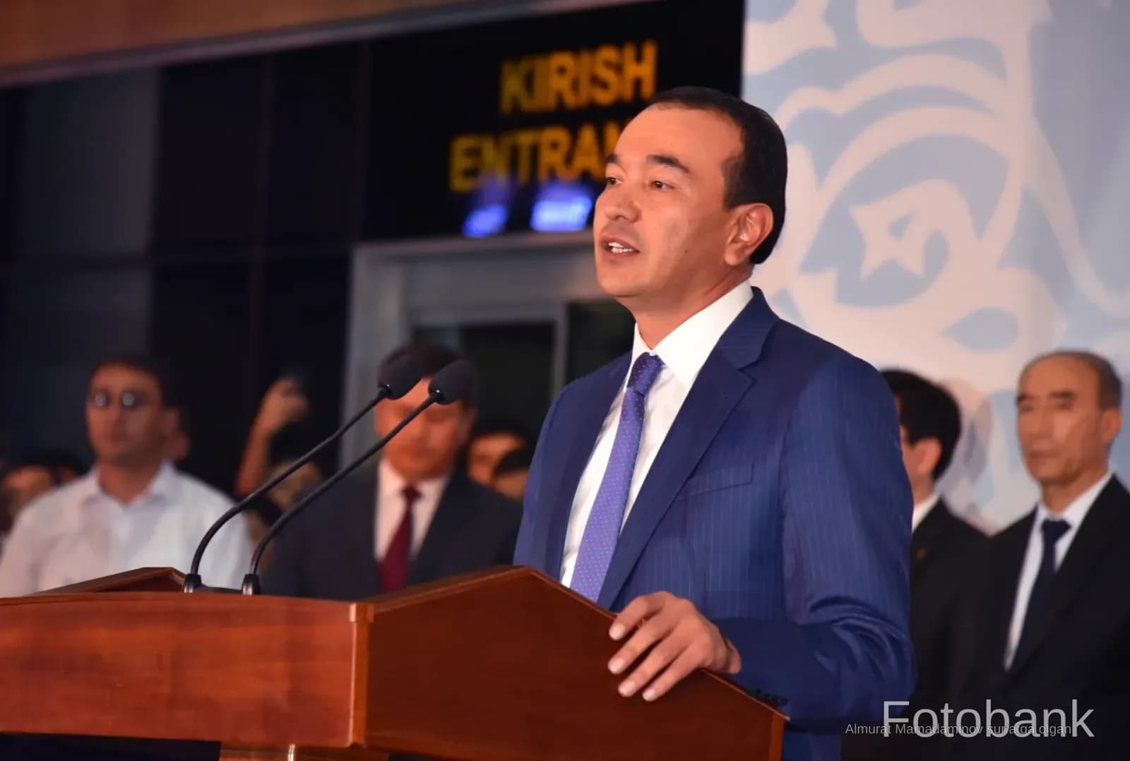 Person speaking at a podium during an event