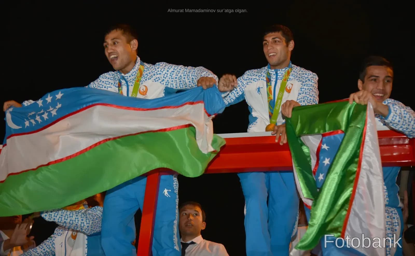Athletes holding flags and celebrating