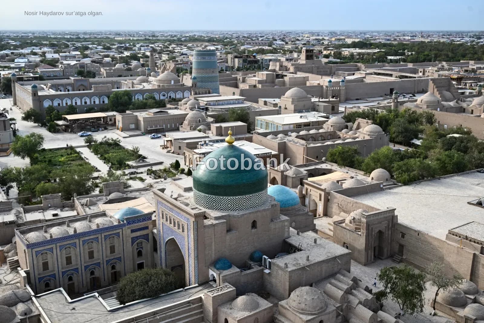 High angle view of historic architectural complex with domes and cityscape