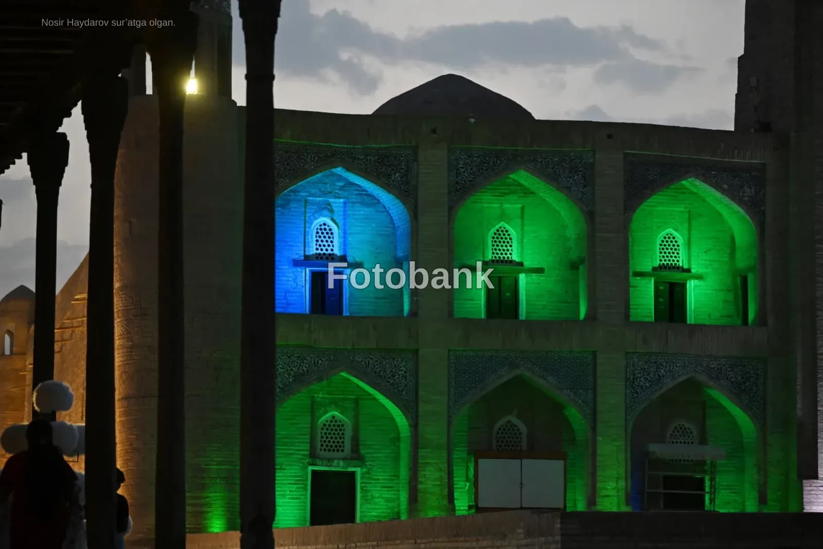 Illuminated historic building facade at dusk