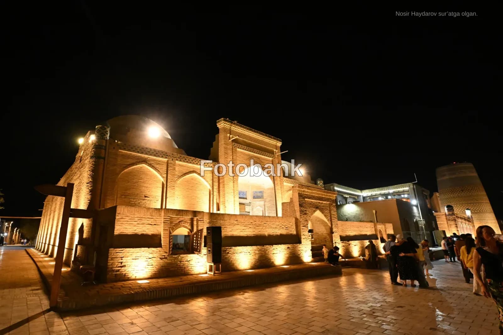 Illuminated historic brick architecture at night