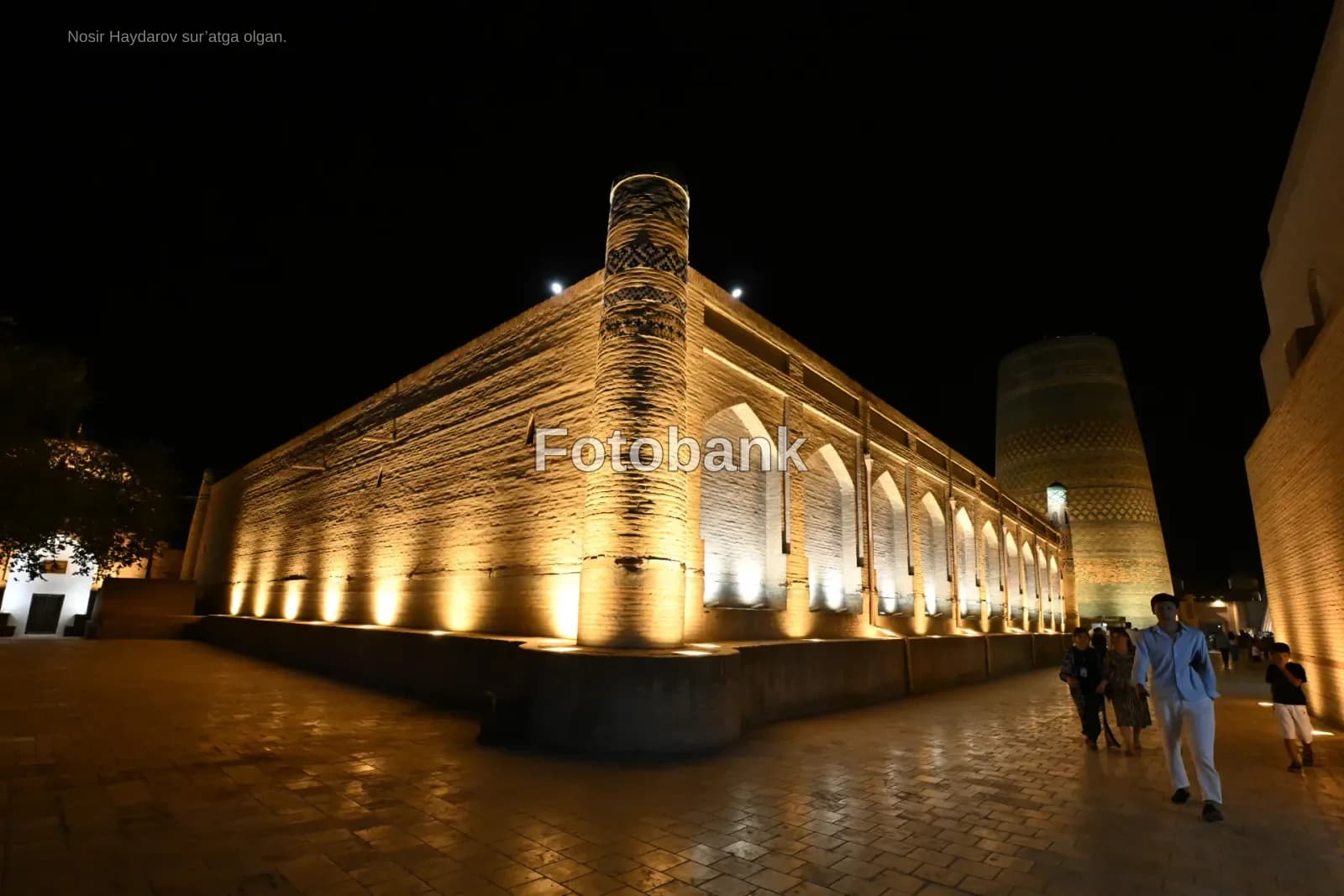 Illuminated historic brick architecture at night