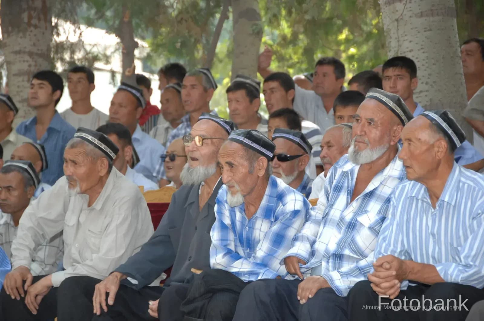 Group of men gathered outdoors