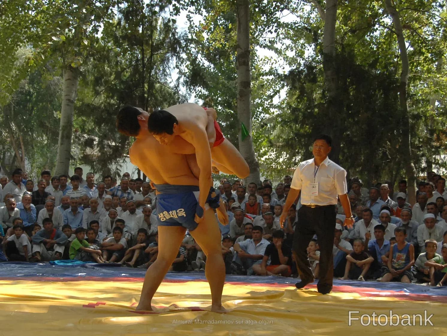 Wrestlers competing in a match