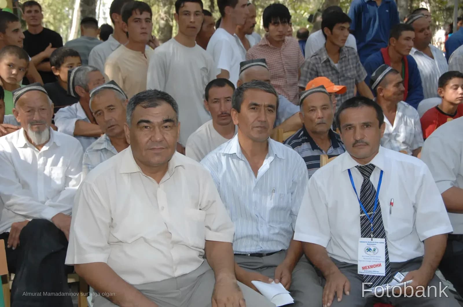 Group of men gathered outdoors