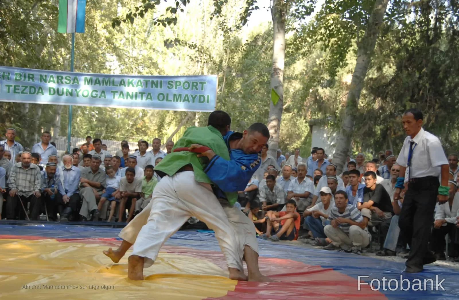 Athletes competing in a traditional wrestling match