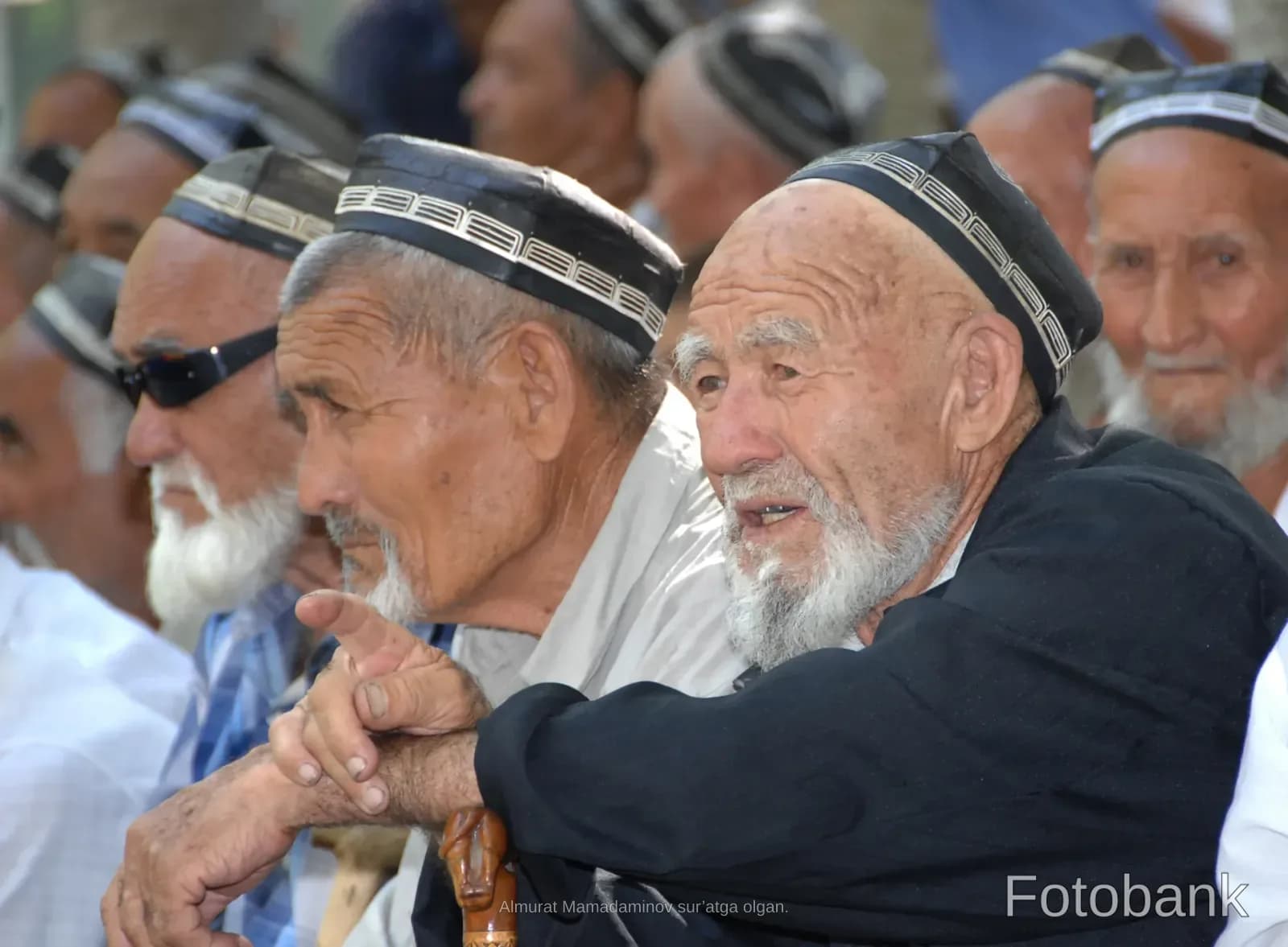 Group of elderly men with traditional caps