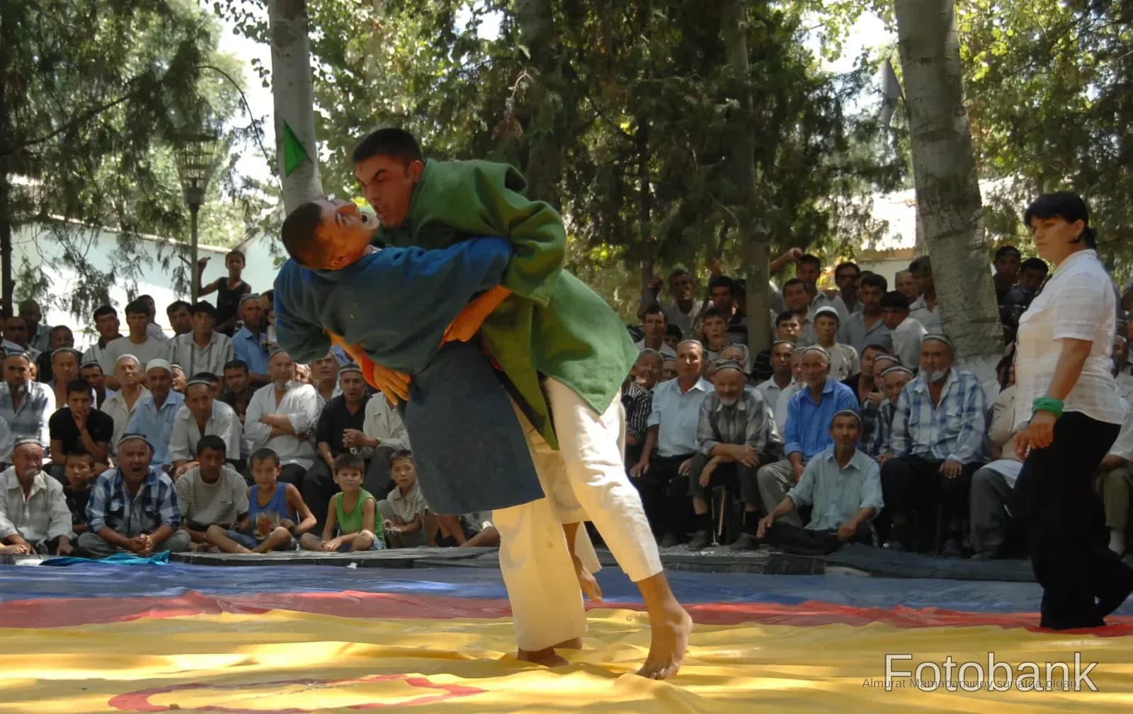 Wrestlers competing in a match
