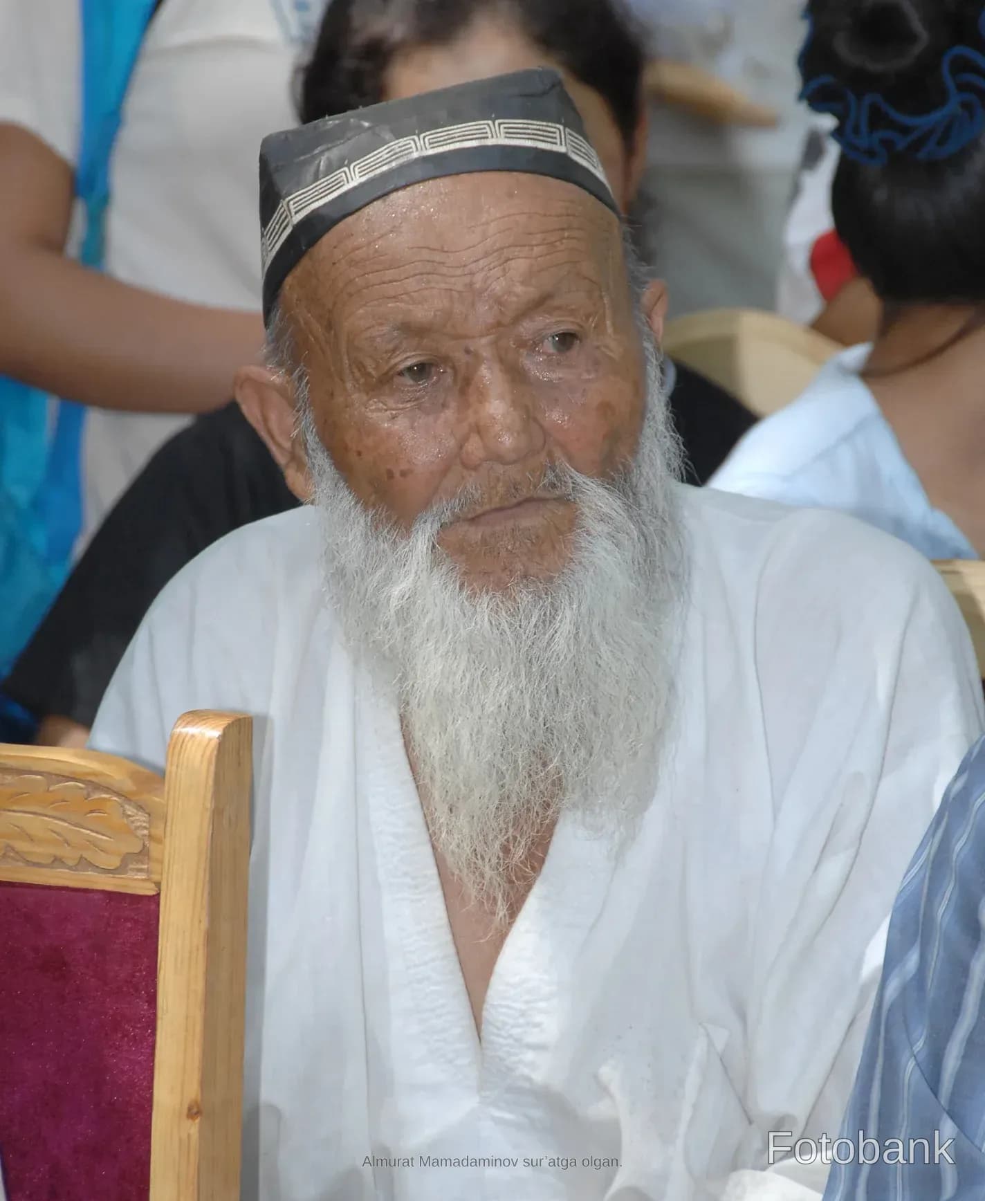 Portrait of an elderly man with a long white beard