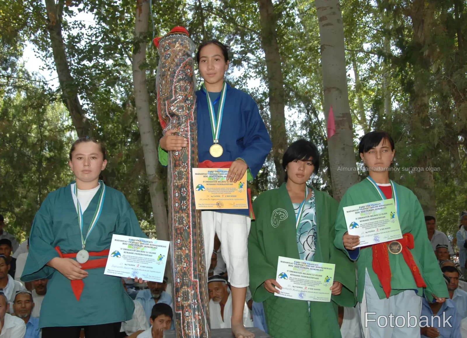 Young athletes with medals and certificates during a sports competition