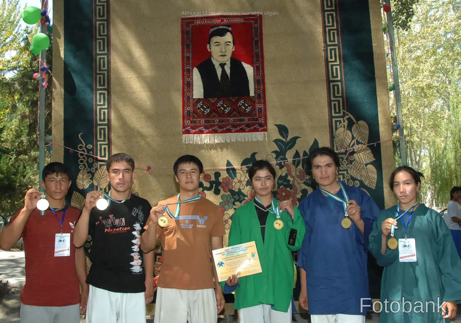 Athletes posing with medals