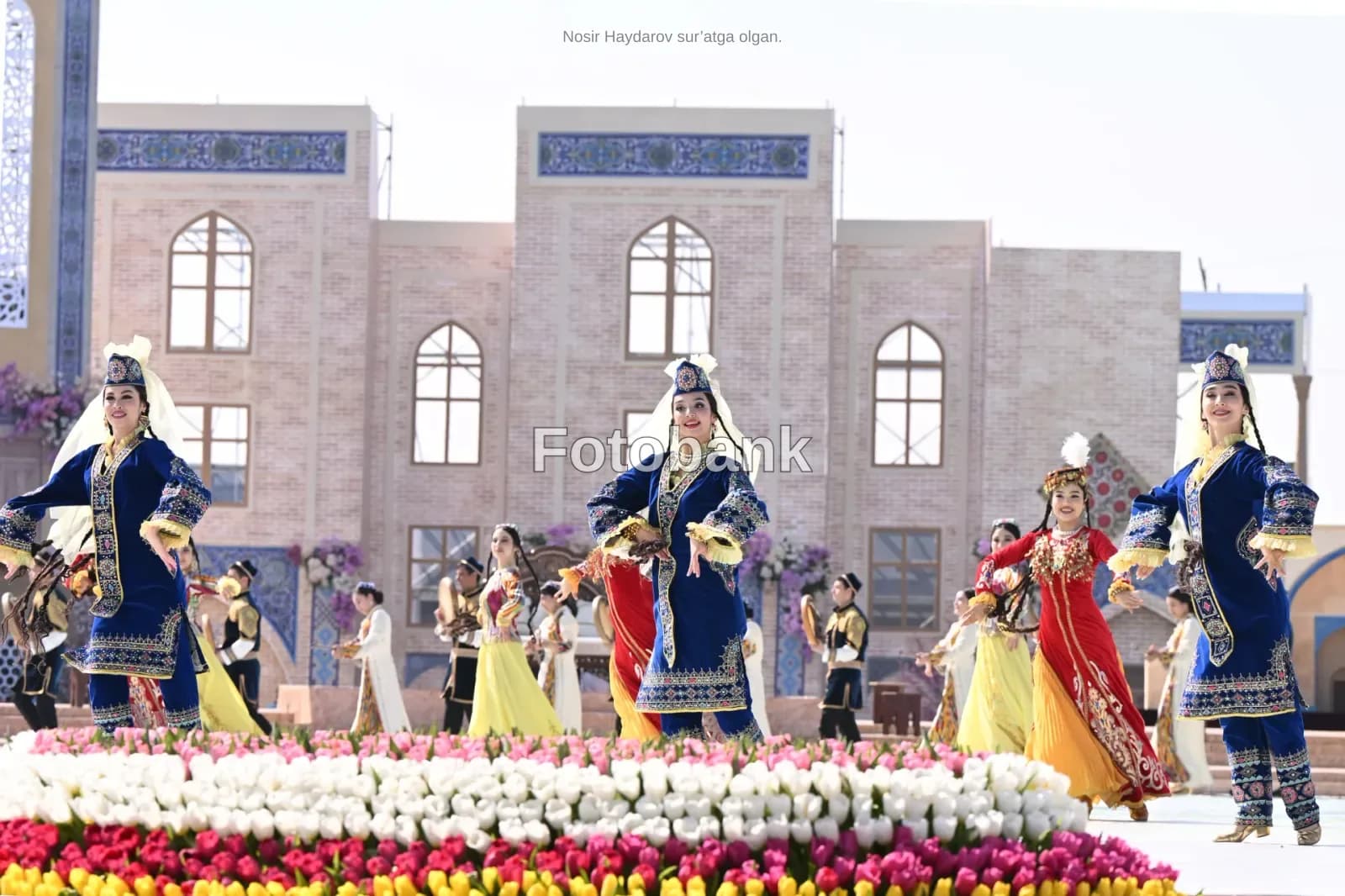 Performers in traditional clothing dancing outdoors