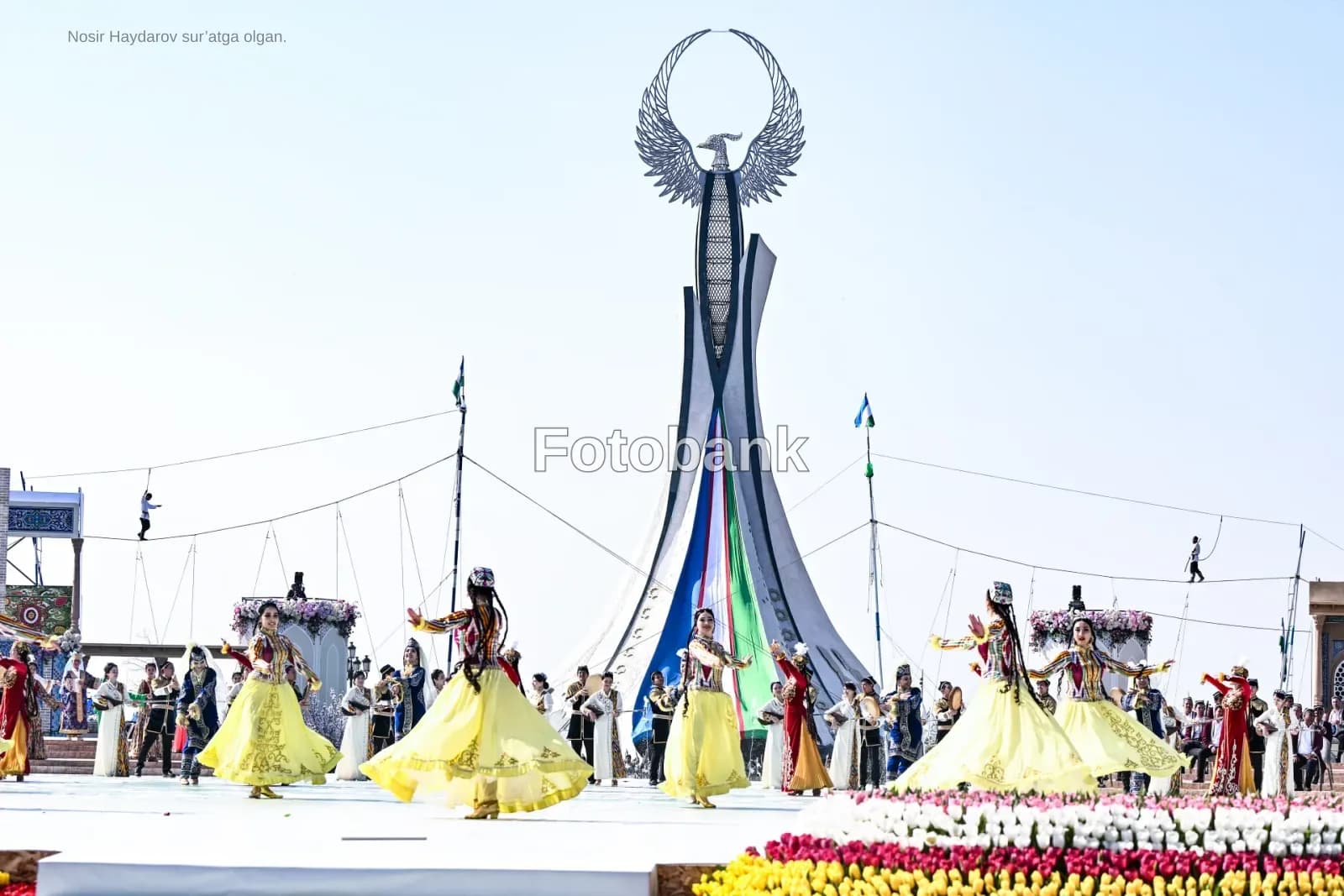 Performers in traditional clothing dancing outdoors