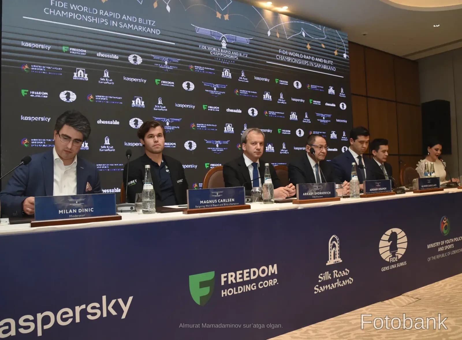 People seated at a press conference table during an international tournament