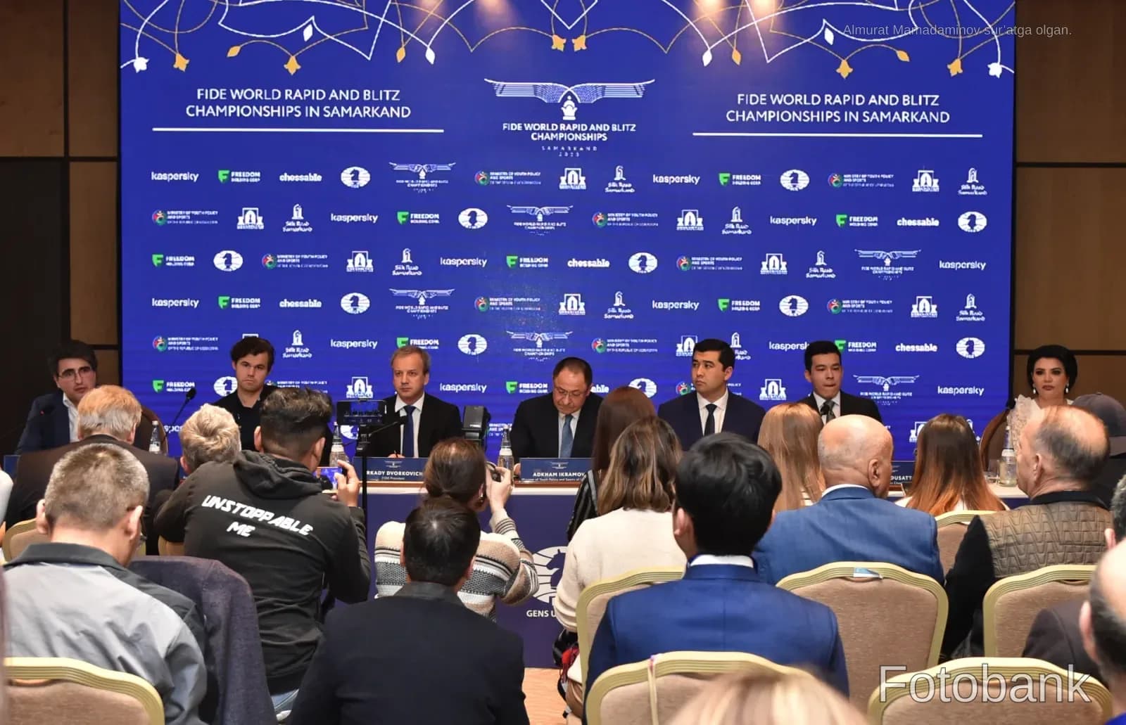 People attending a press conference at a championship event