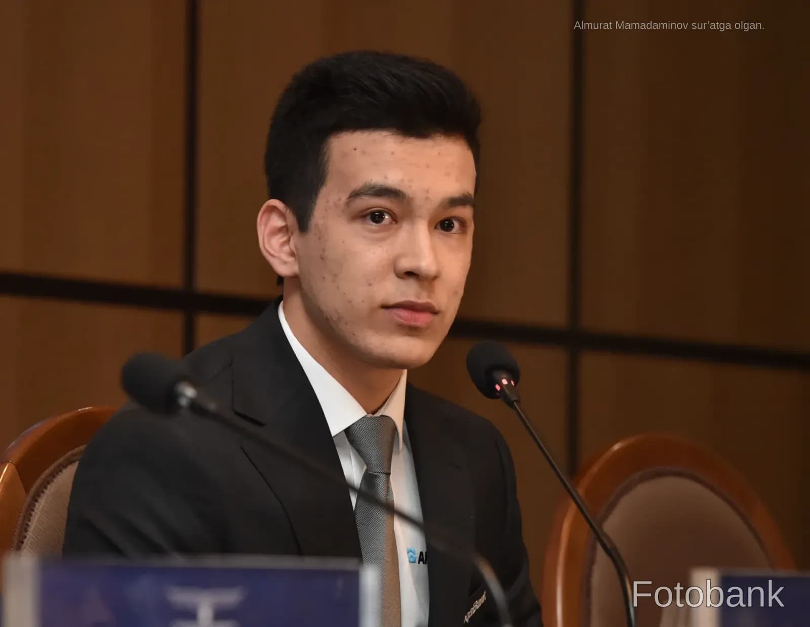 Young man speaking at a conference