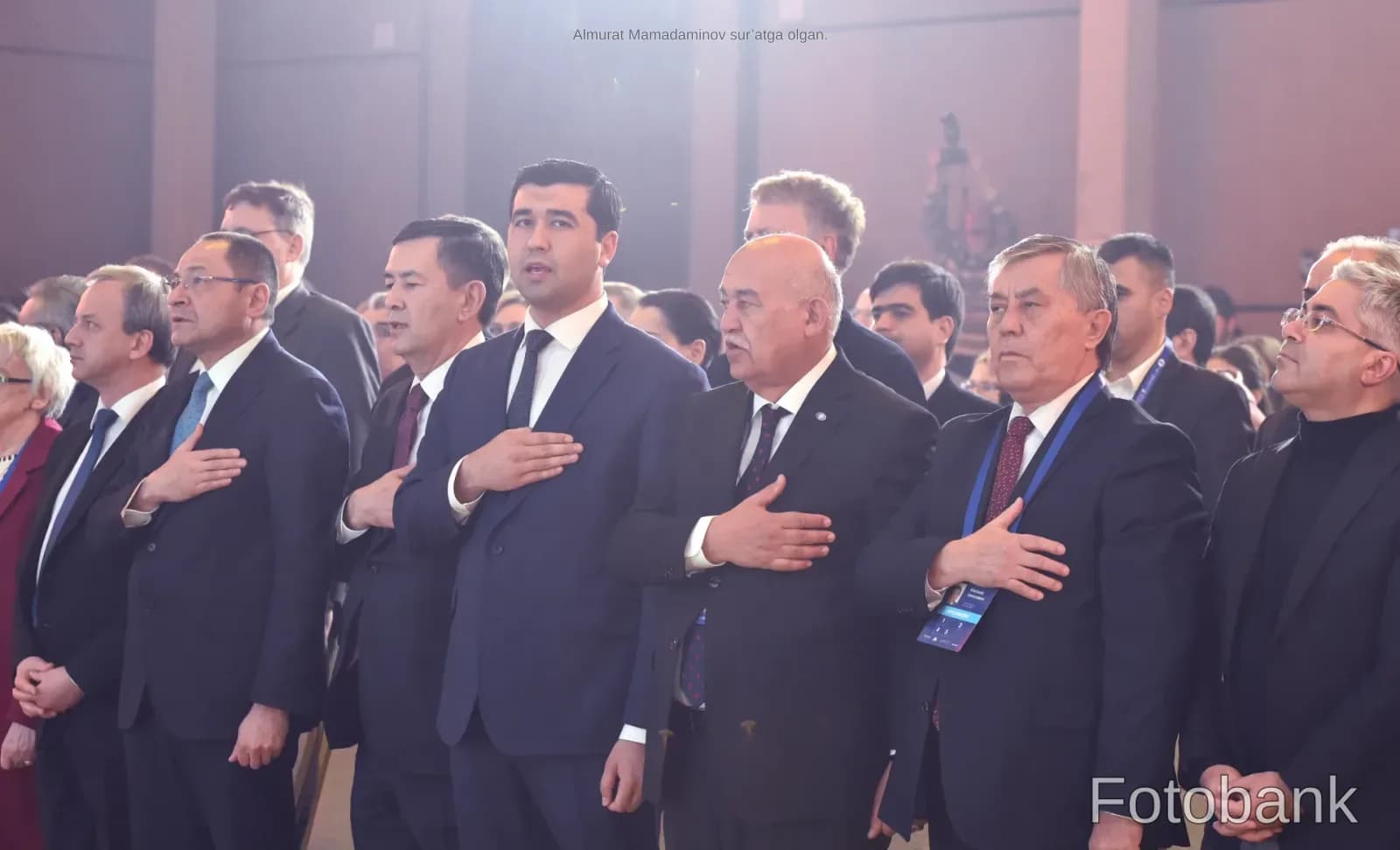 People attending a formal indoor gathering