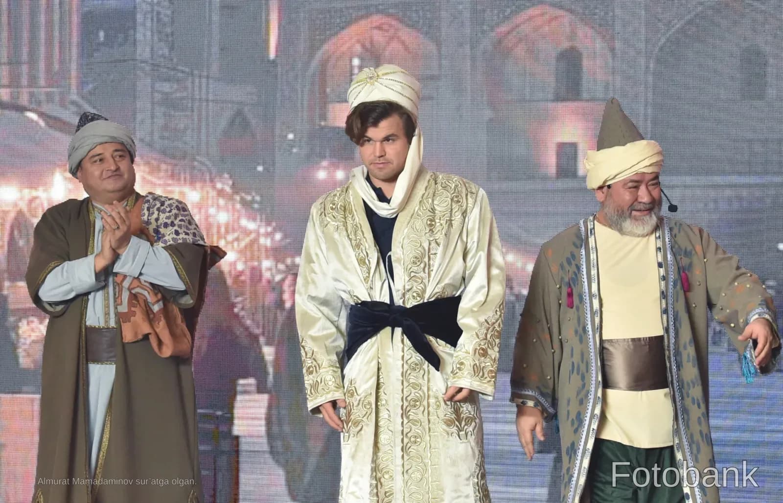 People in traditional clothing on stage