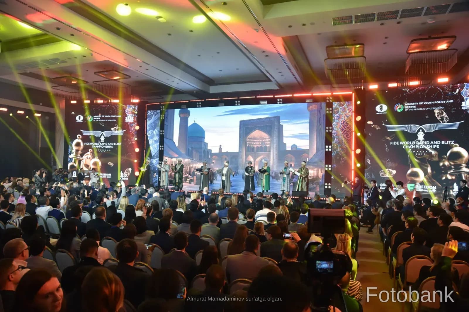 People gathered at an event with stage performances