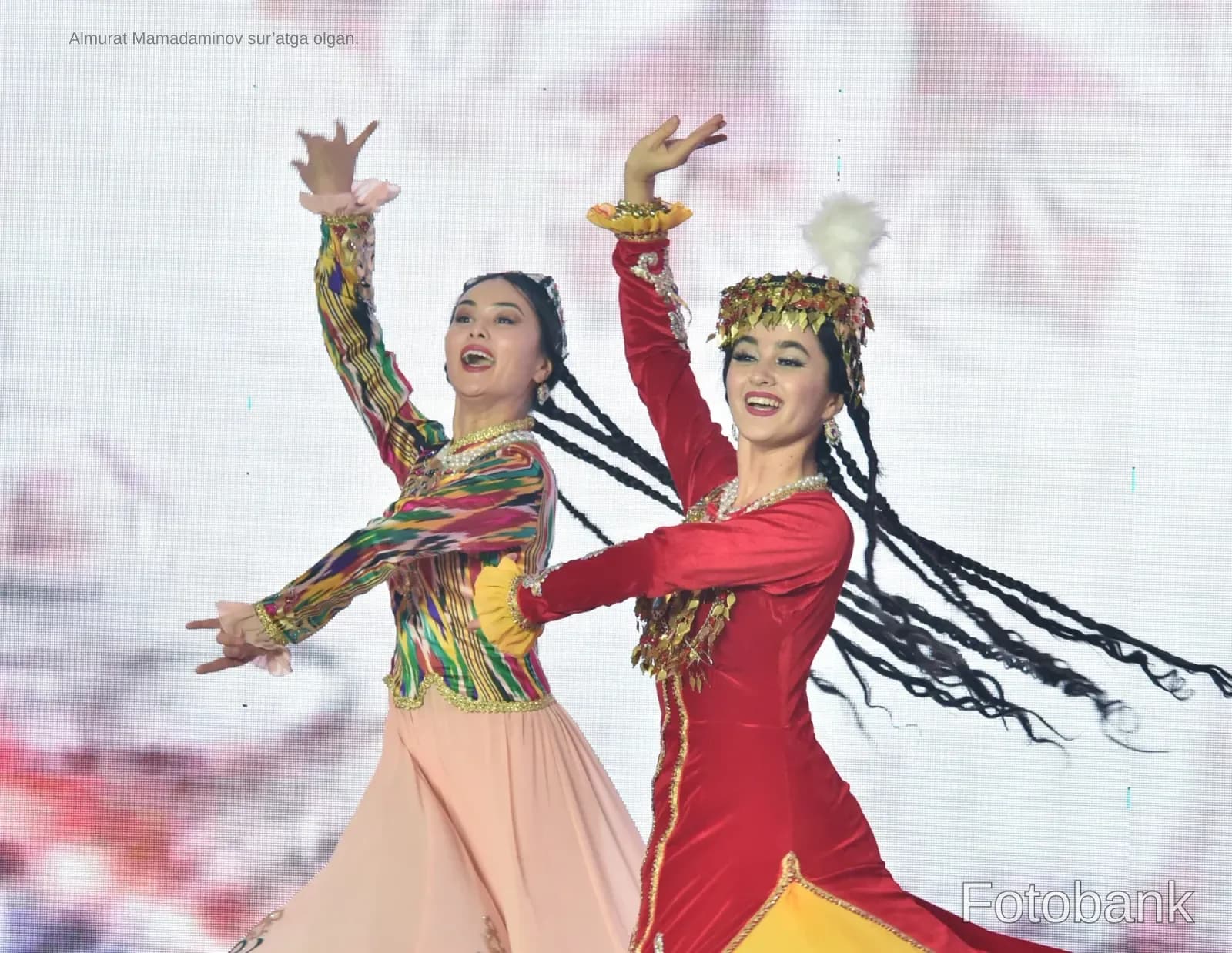 Performers in traditional clothing dancing on stage