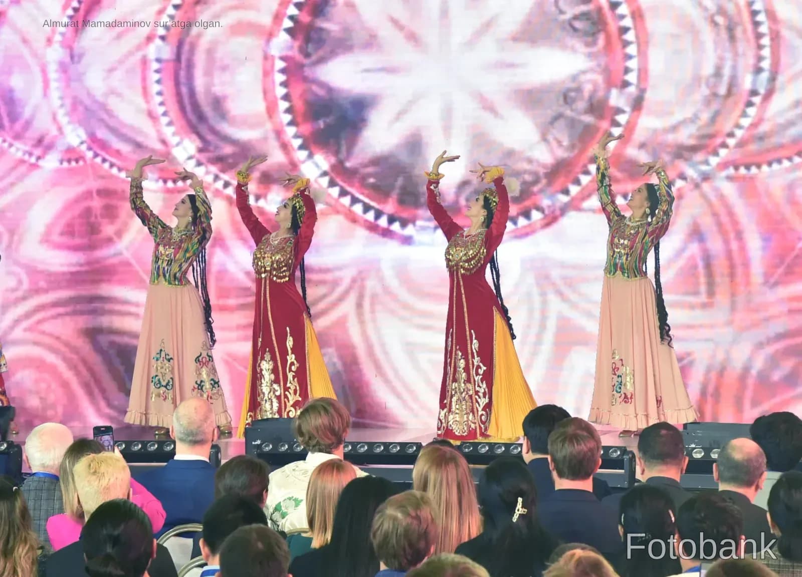 Performers in traditional clothing dancing on stage