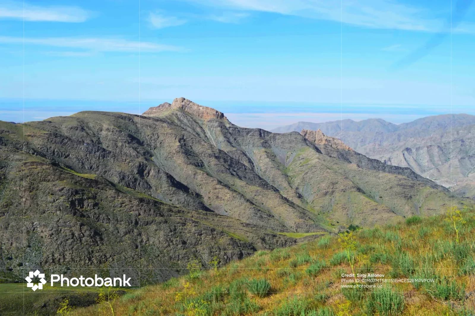 Rugged mountain range landscape under a clear blue sky