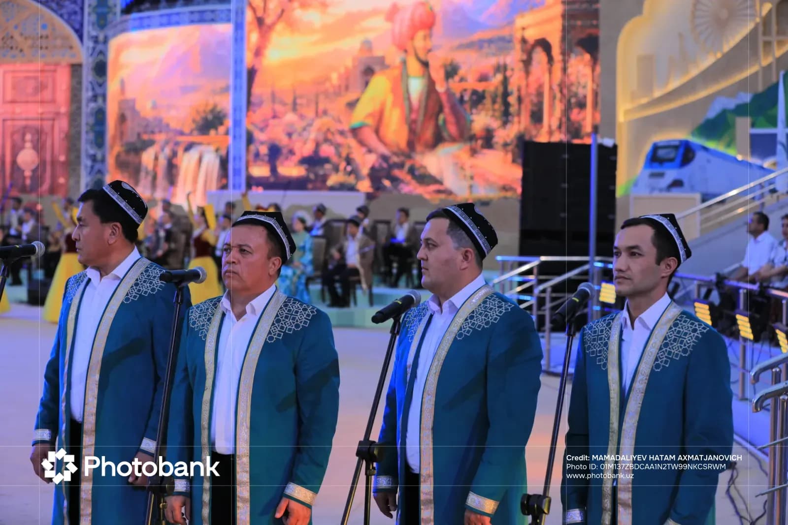 Men performing on stage in traditional attire