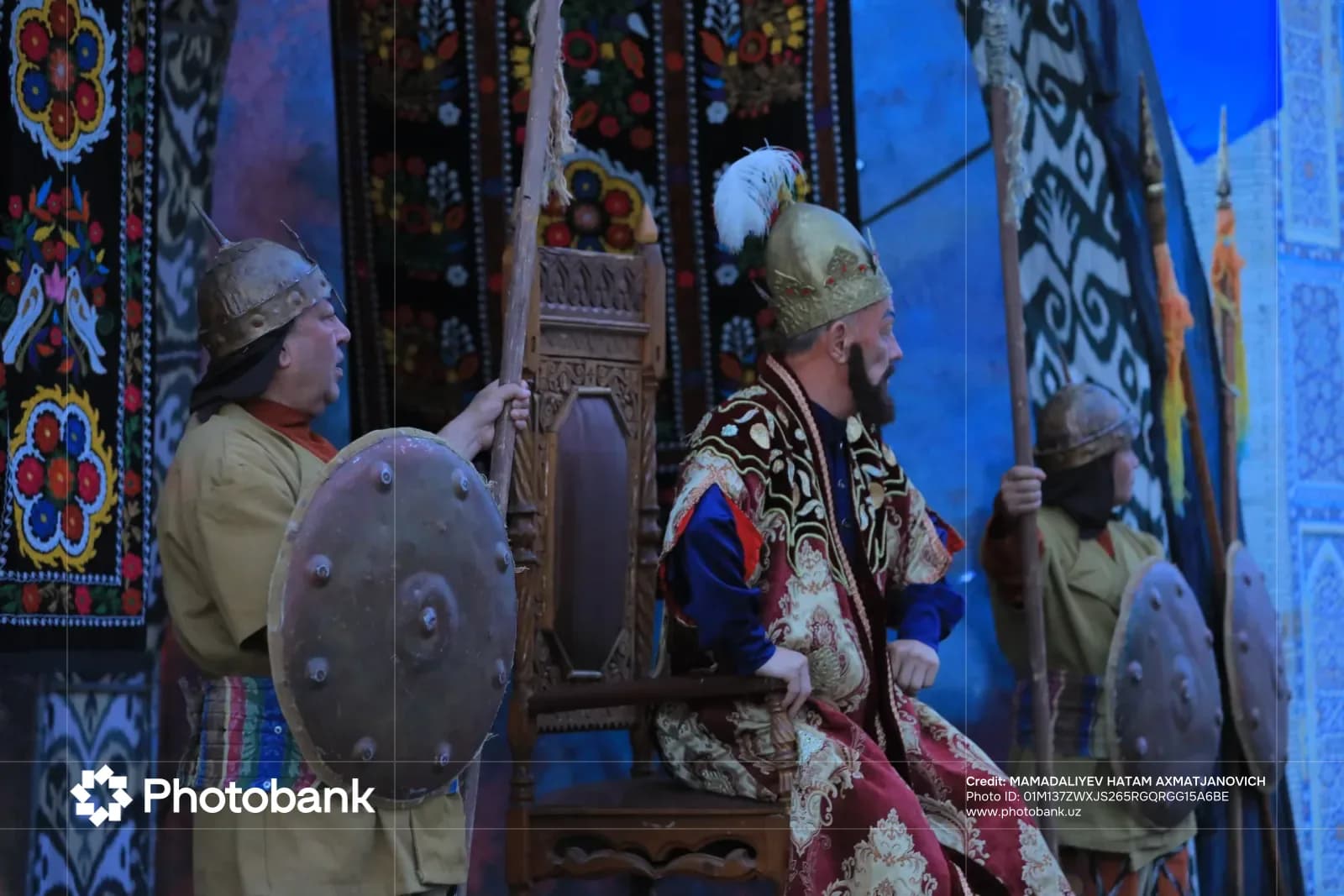 People in traditional historical attire posing with props