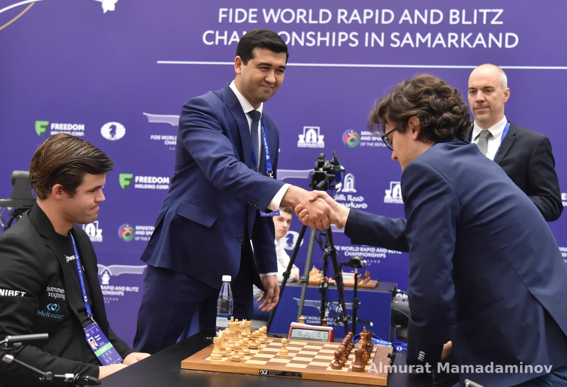 Men shaking hands during a chess competition in Samarkand
