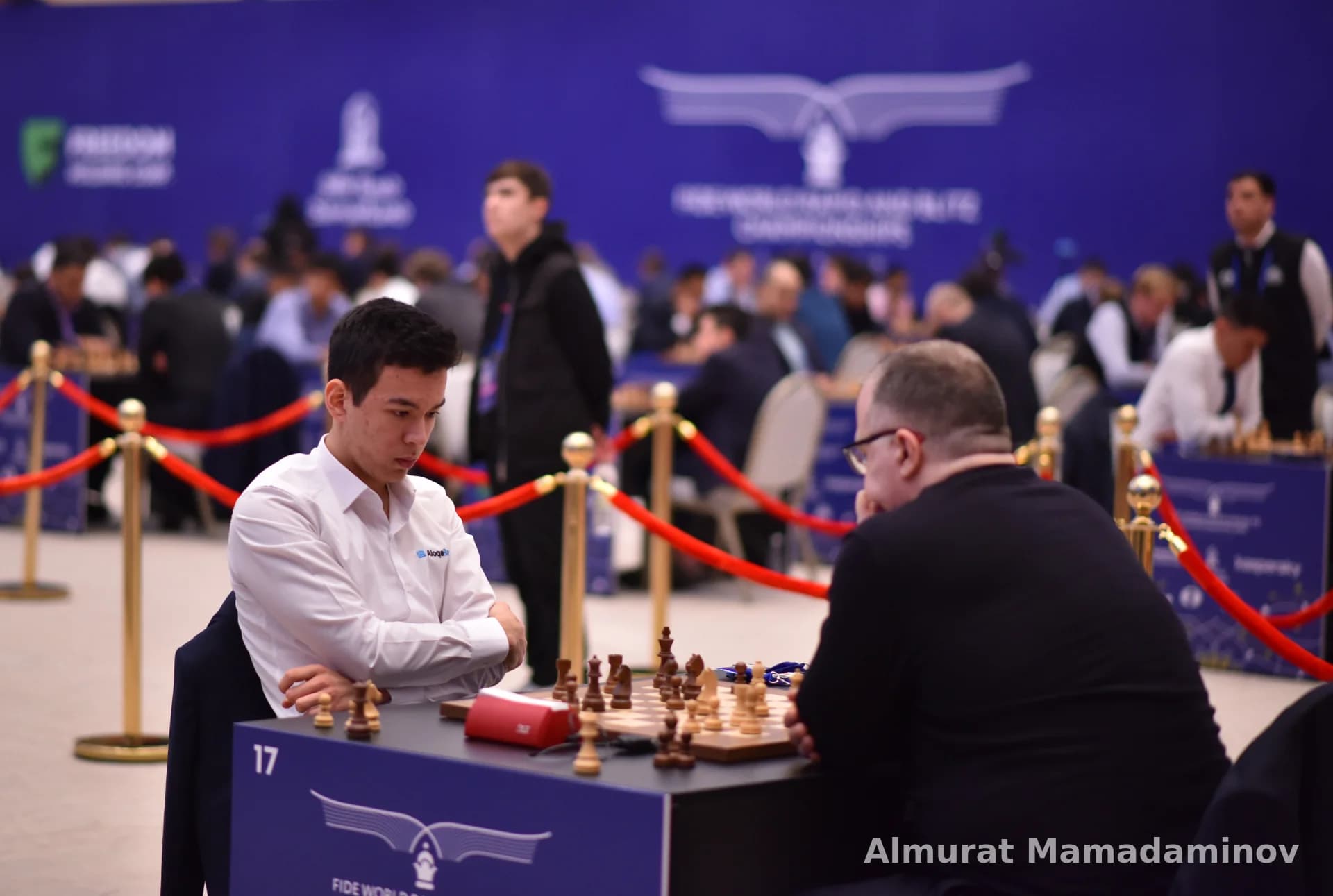 Competitors playing chess at a tournament