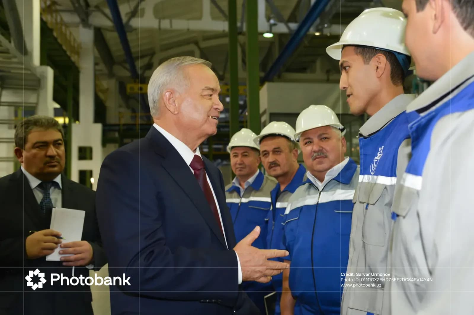 People meeting inside an industrial facility