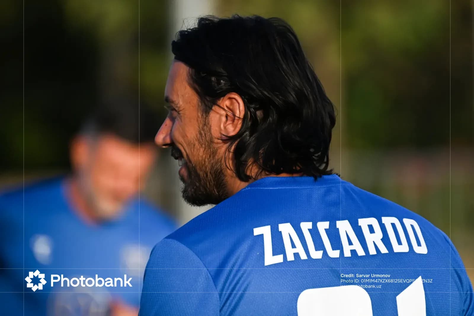 Person in a blue athletic jersey