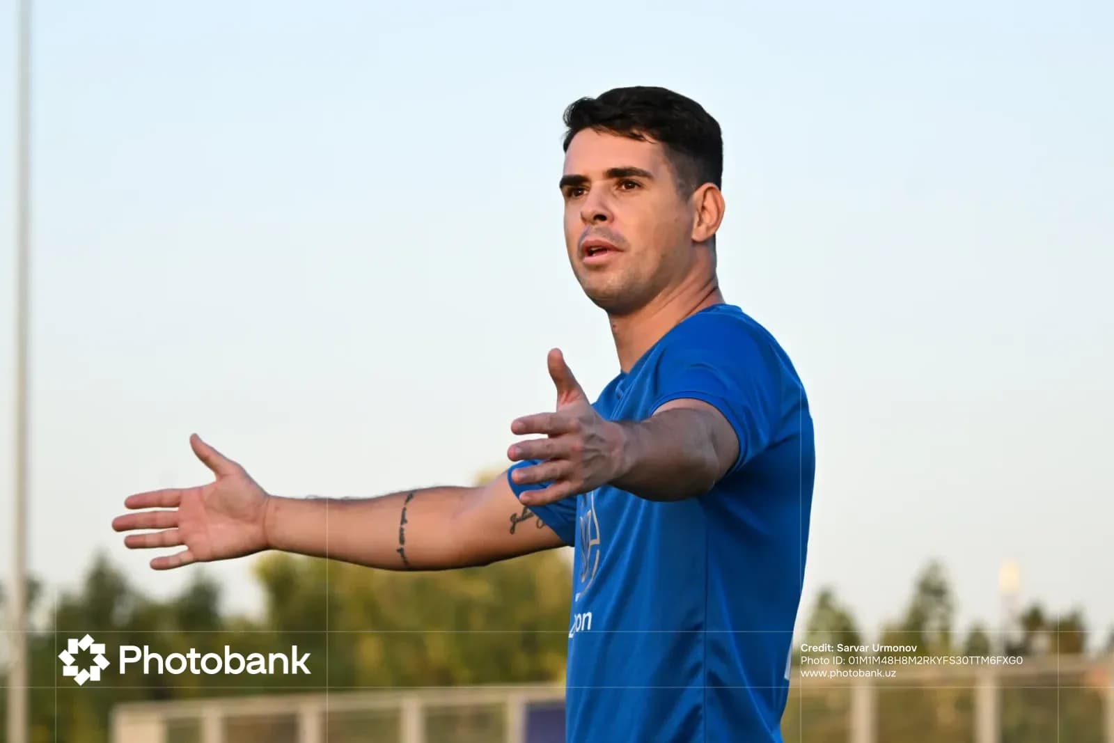 Athlete gesturing outdoors