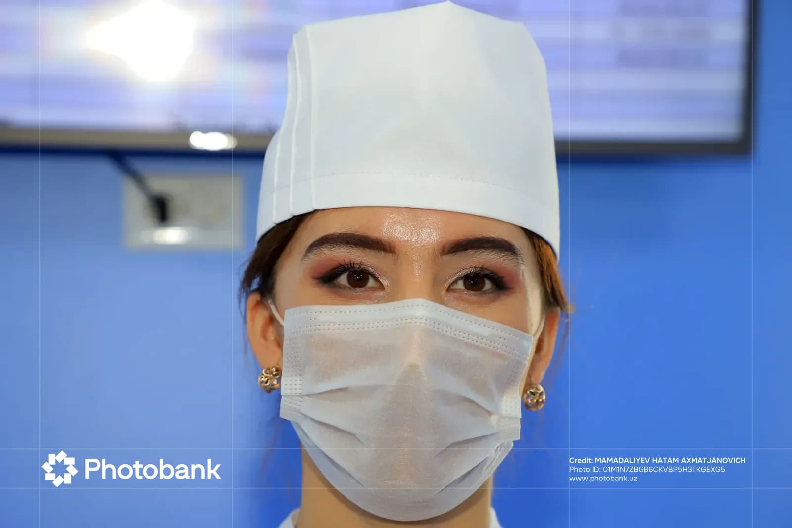 Portrait of a person wearing a medical mask and cap