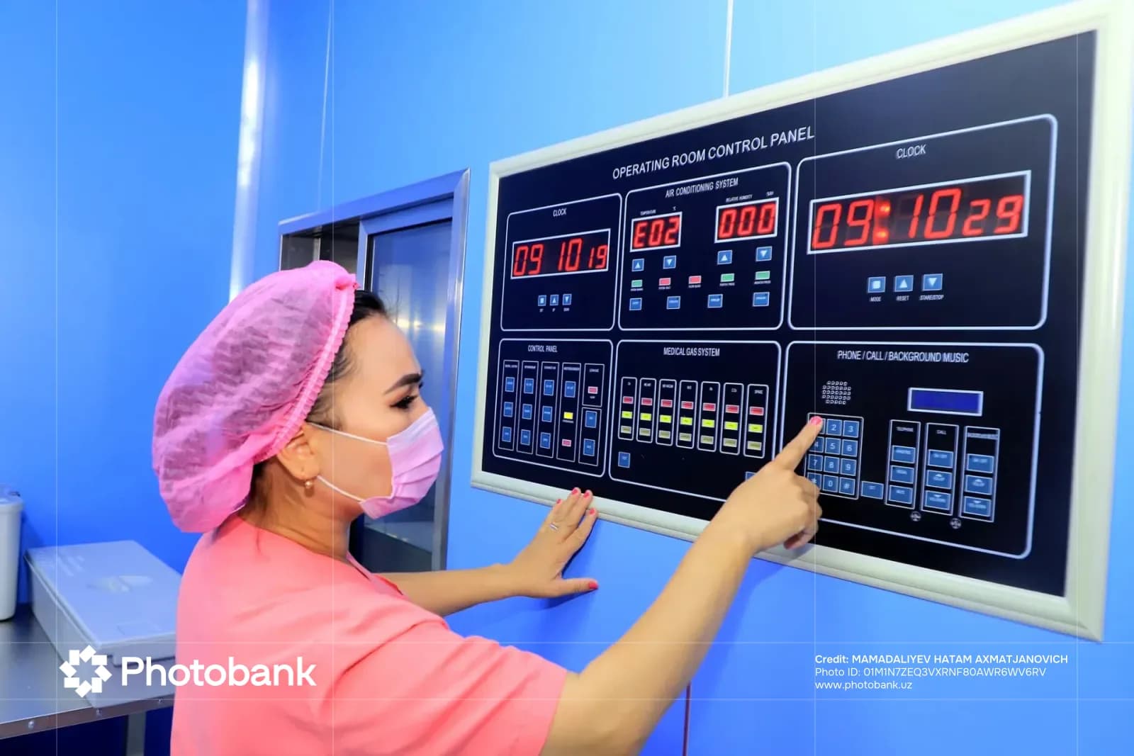 Healthcare worker operates medical equipment control panel