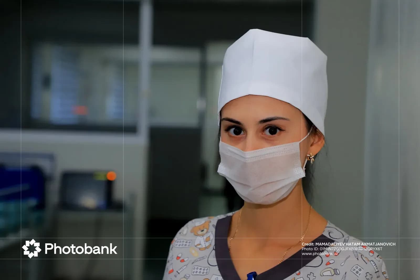 Portrait of a medical professional wearing a mask and cap