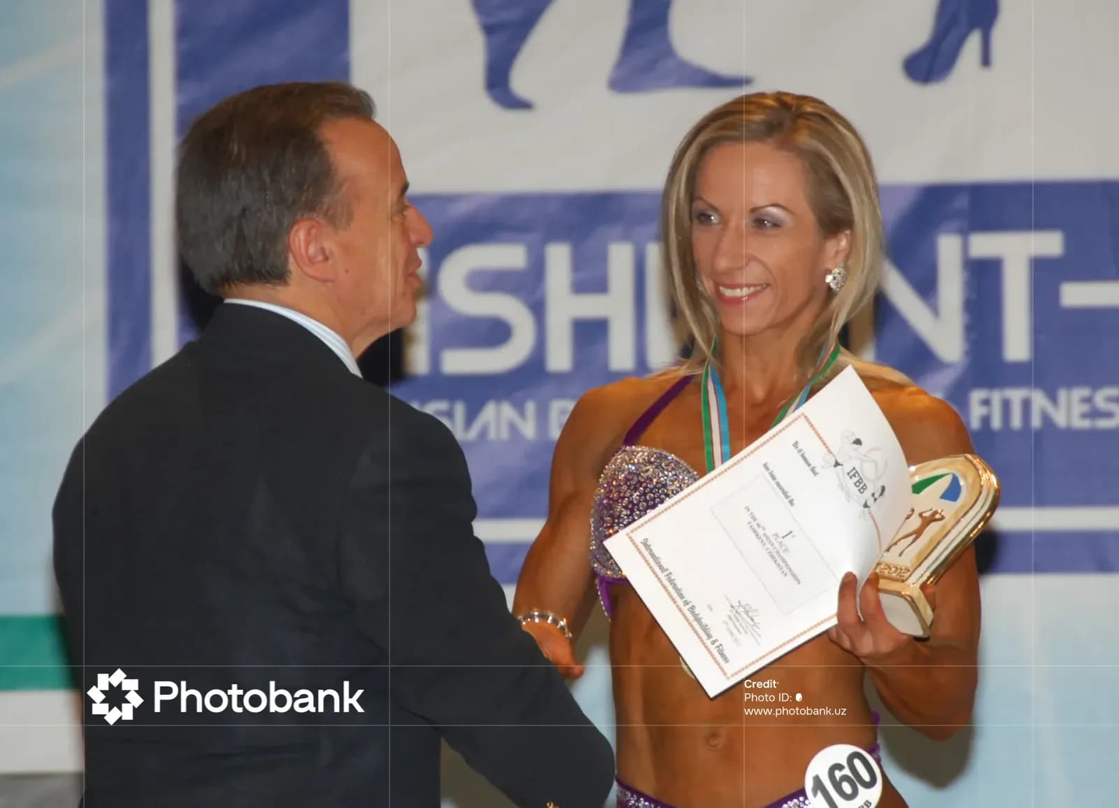 Participant receiving a sports award at a competition