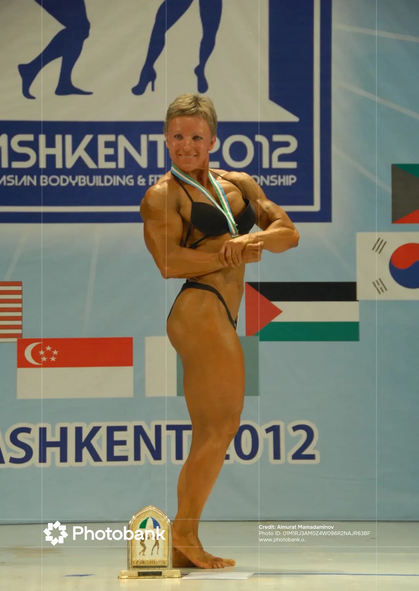 Female bodybuilder posing on stage