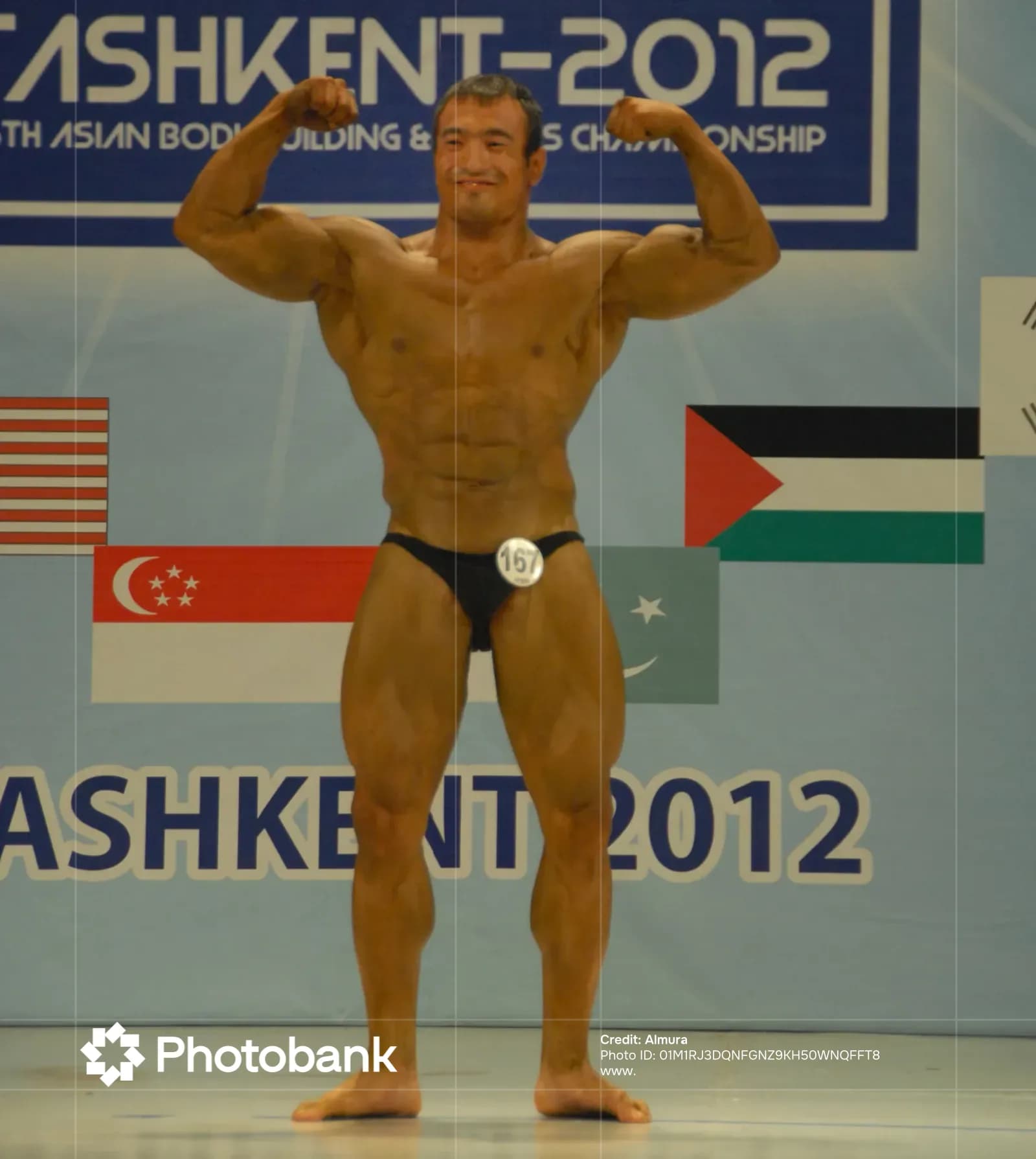 Athlete flexing muscles on stage