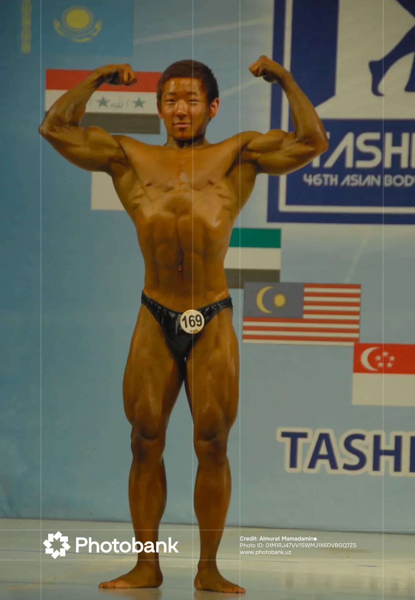 Bodybuilder posing on stage during competition