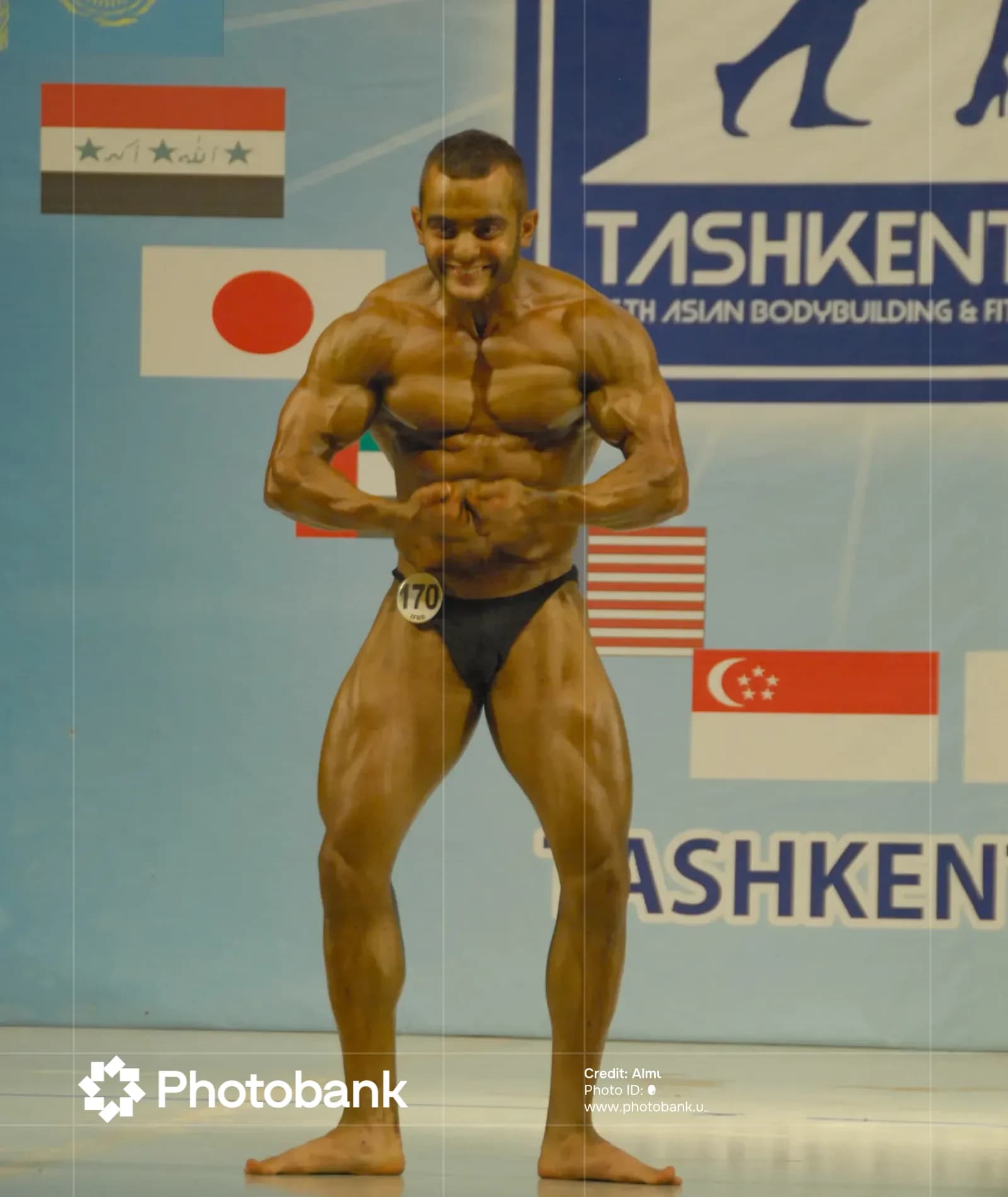Bodybuilder posing during a sports competition
