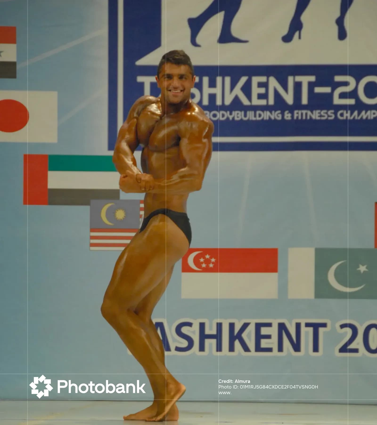 Bodybuilder poses on stage