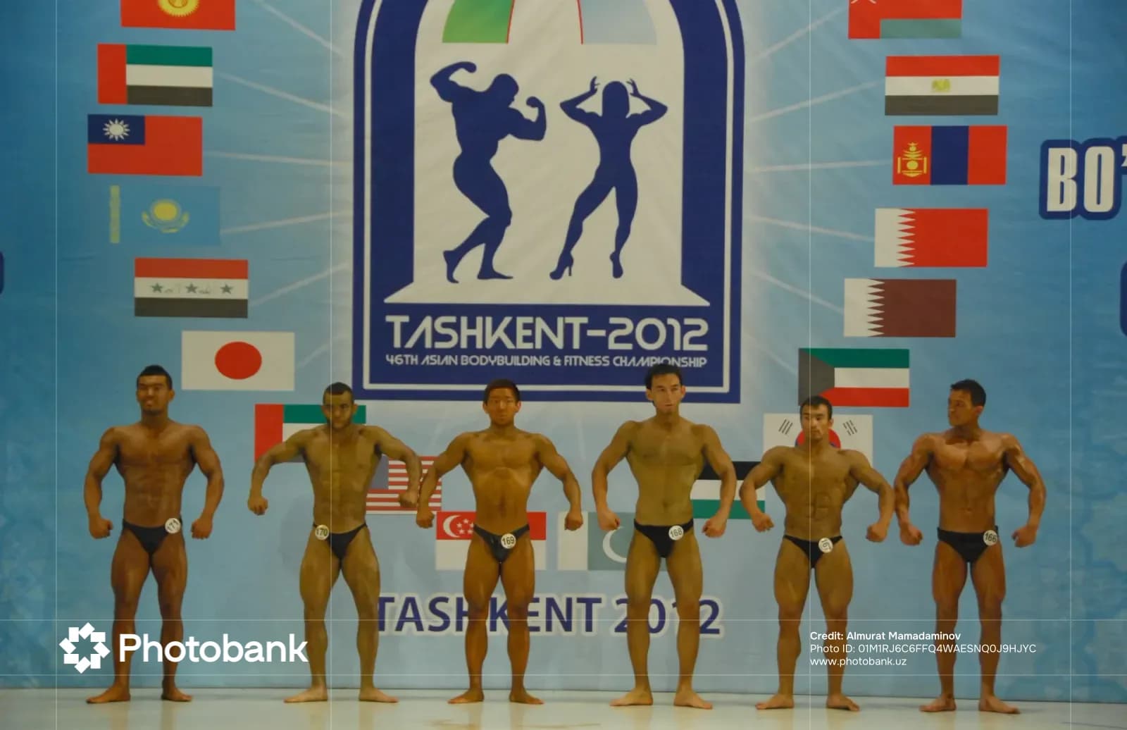 Bodybuilders posing on stage during a competition